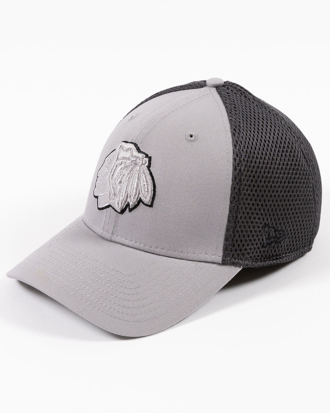 grey fitted New Era cap with tonal grey Chicago Blackhawks primary logo on front - left angle lay lay flat