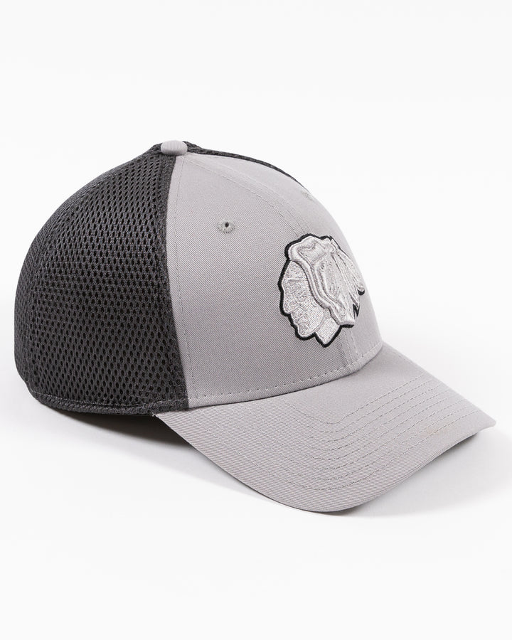 grey fitted New Era cap with tonal grey Chicago Blackhawks primary logo on front - right angle lay lay flat