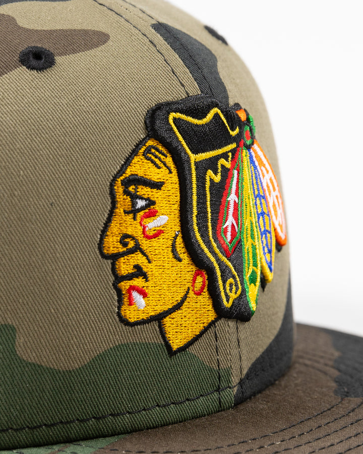 camo New Era 9FIFTY adjustable snapback cap with Chicago Blackhawks primary logo embroidered on front - detail lay flat