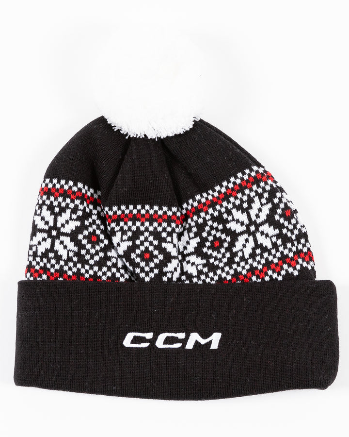 black CCM knit hat with pom with fair isle sweater pattern detail and embroidered Blackhawks wordmark on front cuff - back lay flat