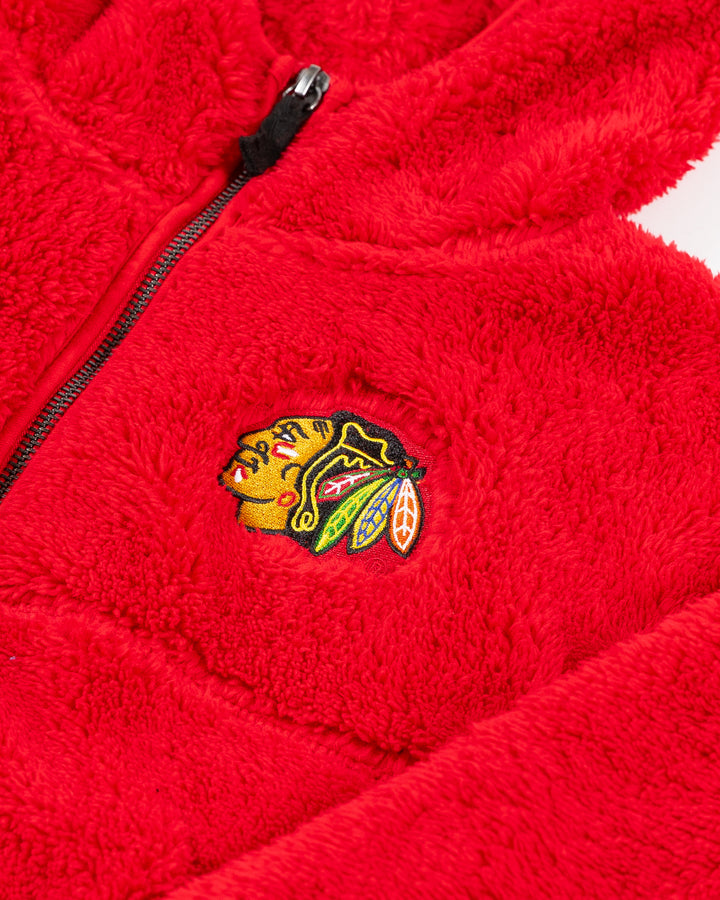 red Colosseum youth girl hooded sherpa jacket with Chicago Blackhawks primary logo embroidered on left chest - detail lay flat