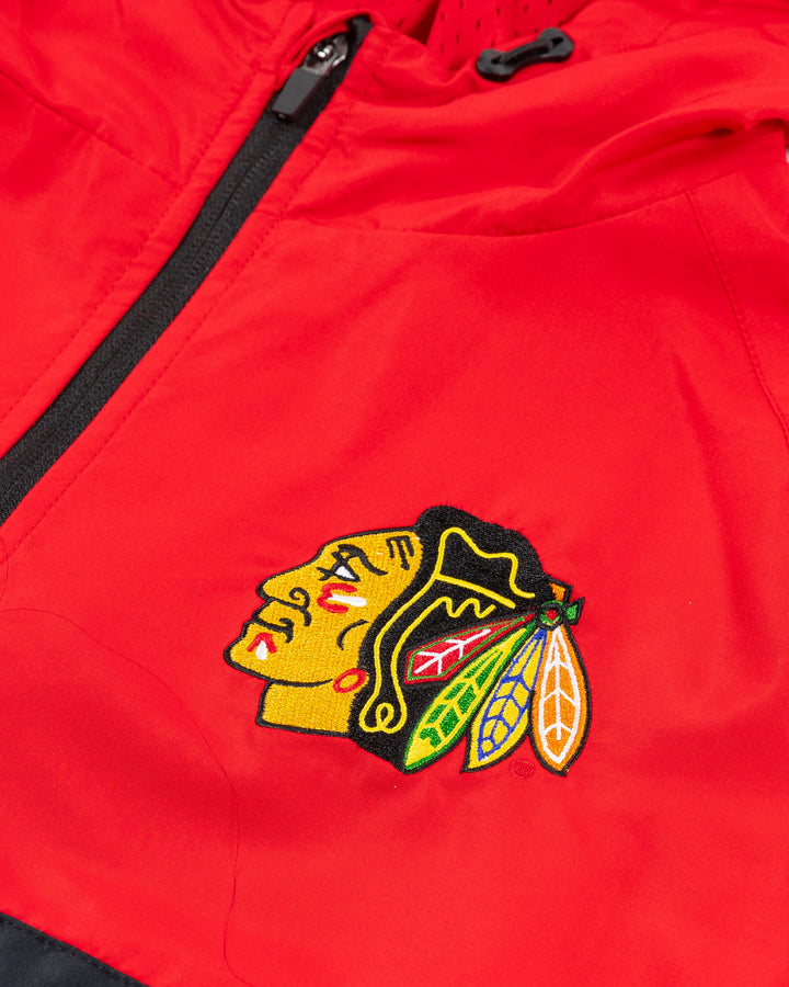 red Colosseum half zip hoodie jacket with Chicago Blackhawks primary logo on left chest and Blackhawks wordmark on shoulder on right arm - detail front lay flat