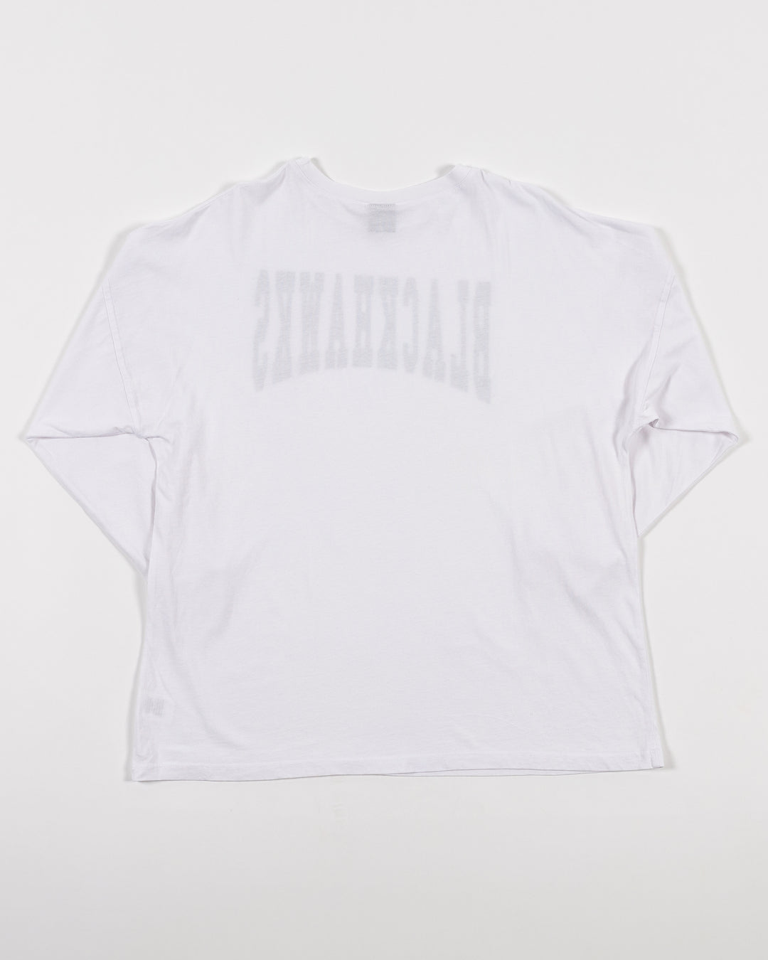 white chicka-d long sleeve oversized tee with Chicago Blackhawks wordmark across front - back lay flat