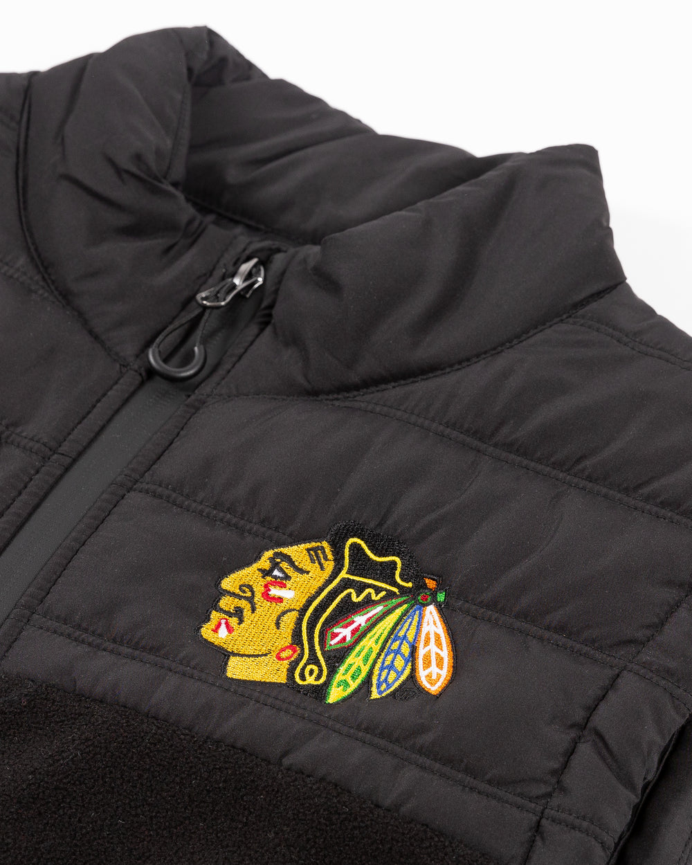 black Coloseum vest with embroidered Chicago Blackhawks primary logo on left chest - detail lay flat