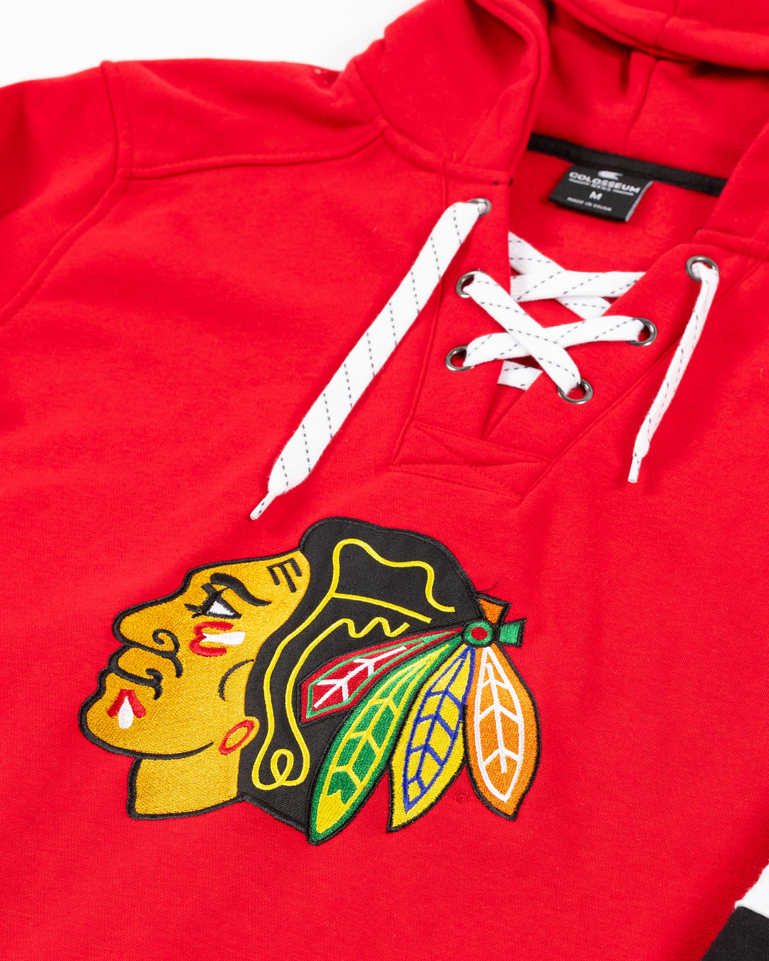 red Colosseum lace up hoodie inspired by hockey jersey with Chicago Blackhawks primary logo on front - front detail lay flat