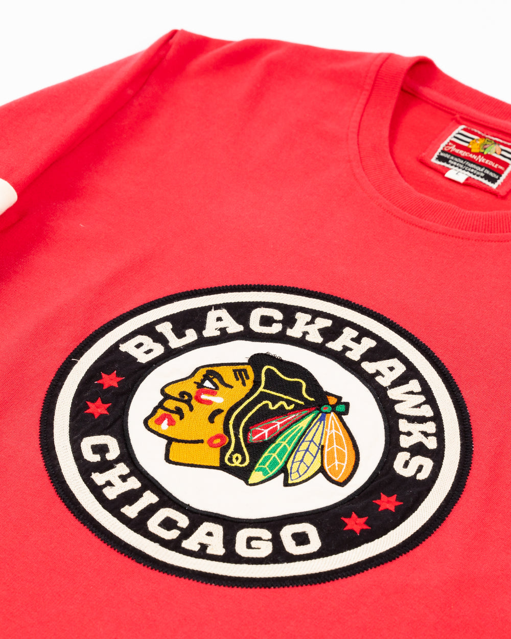 American Needle red long sleeve tee with Chicago Blackhawks Winter Classic logo embroidered on front and striping on sleeves - front detail lay flat