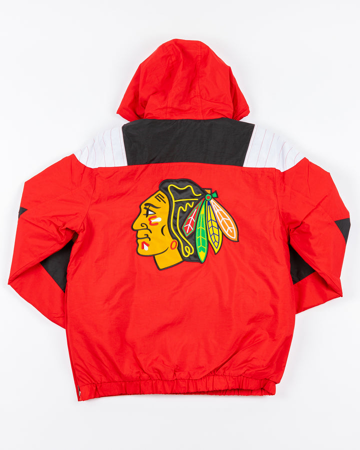 color blocked red, black and white half zip Starter jacket with hood with Chicago Blackhawks primary logo adorning front pocket and back - back lay flat