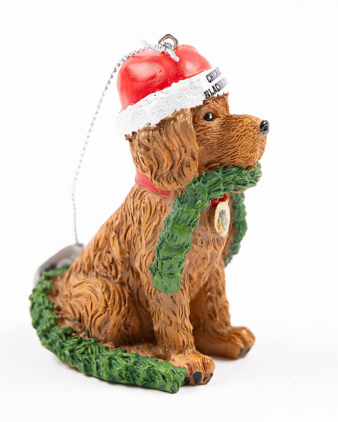 dog wearing Santa hat and holding garland with Chicago Blackhawks wordmark and primary logo ornament - side lay flat