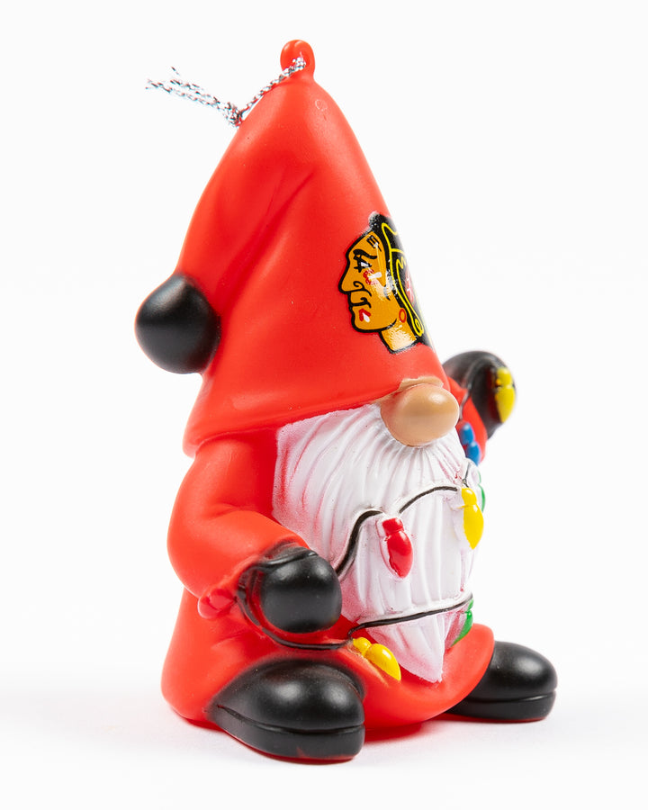 gnome with Chicago Blackhawks primary logo on hat holding holiday string lights ornament - right angle lay flat