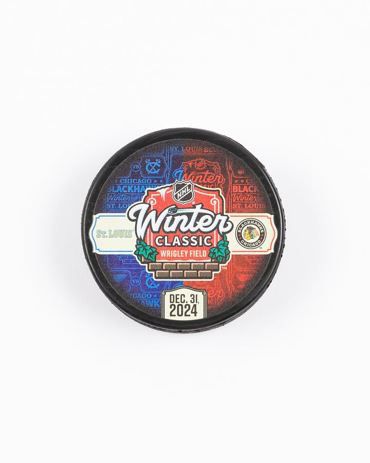 Mustang hockey puck with Winter Classic at Wrigley Field graphic on front against Chicago Blackhawks vs. St. Louis Blues - front lay flat