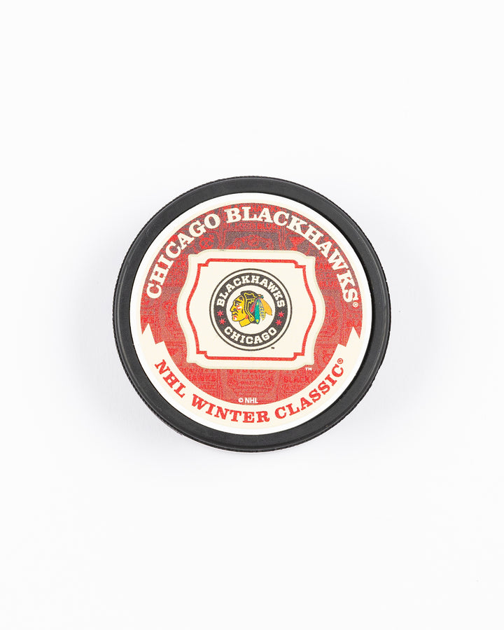 Mustang hockey puck with Chicago Blackhawks Winter Classic matchup against St. Louis design on front - front lay flat