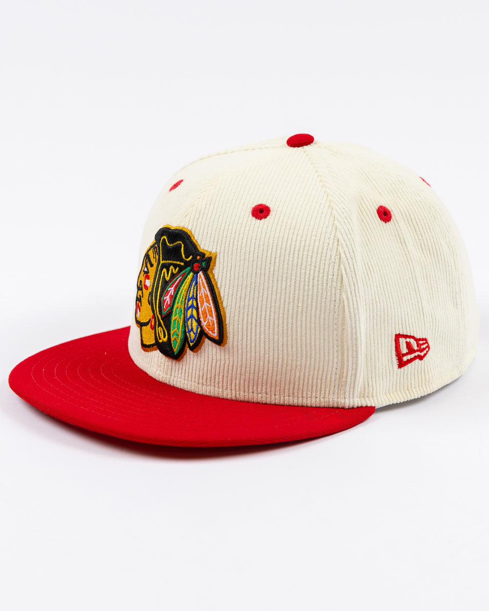 cream corduroy and red brim New Era snapback cap with Chicago Blackhawks primary logo embroidered on front and secondary logo embroidered on rights ide - left angle lay flat