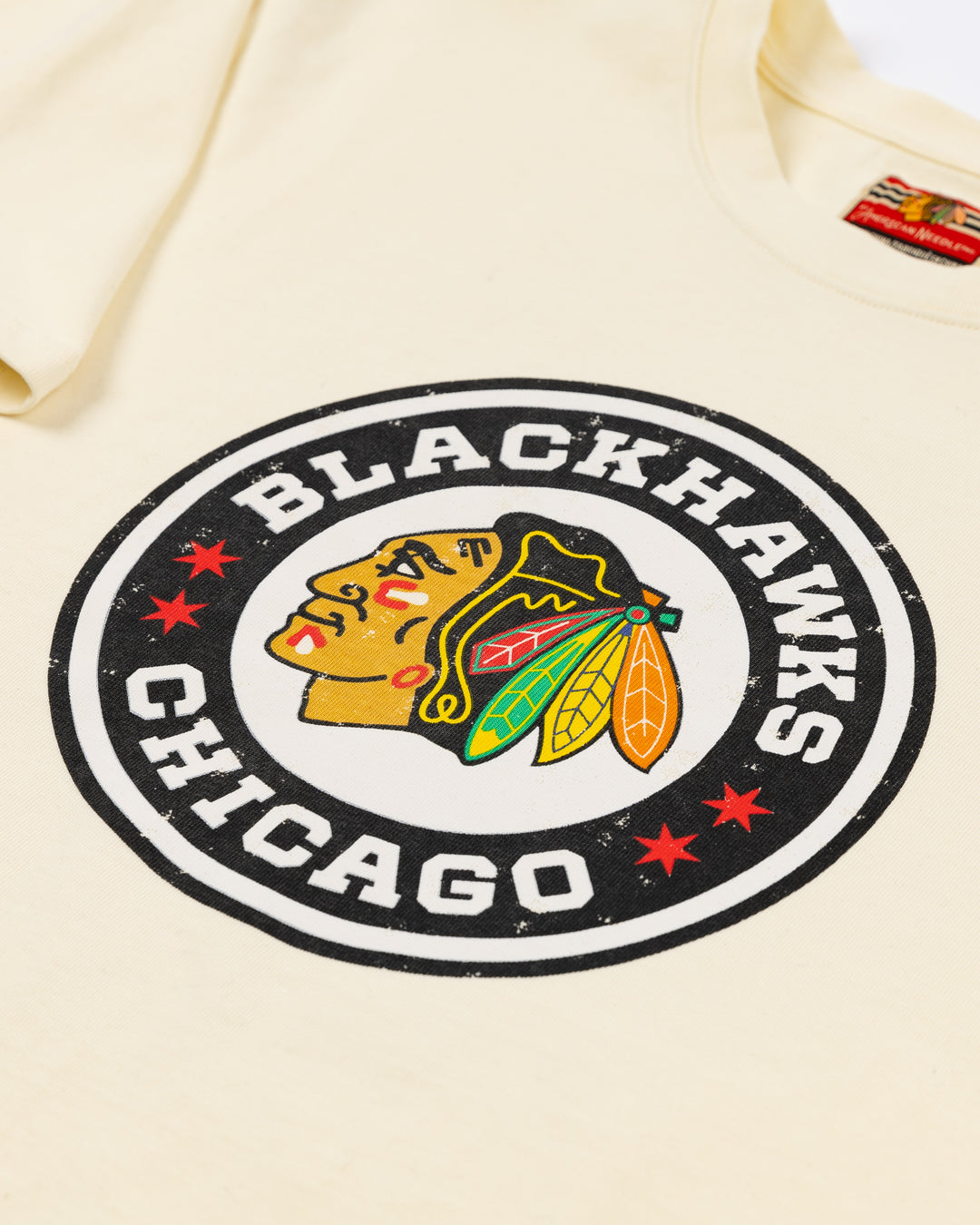 cream American Needle short sleeve tee with Chicago Blackhawks Winter Classic logo on front and NHL Winter Classic logo on left sleeve - front detail lay flat 