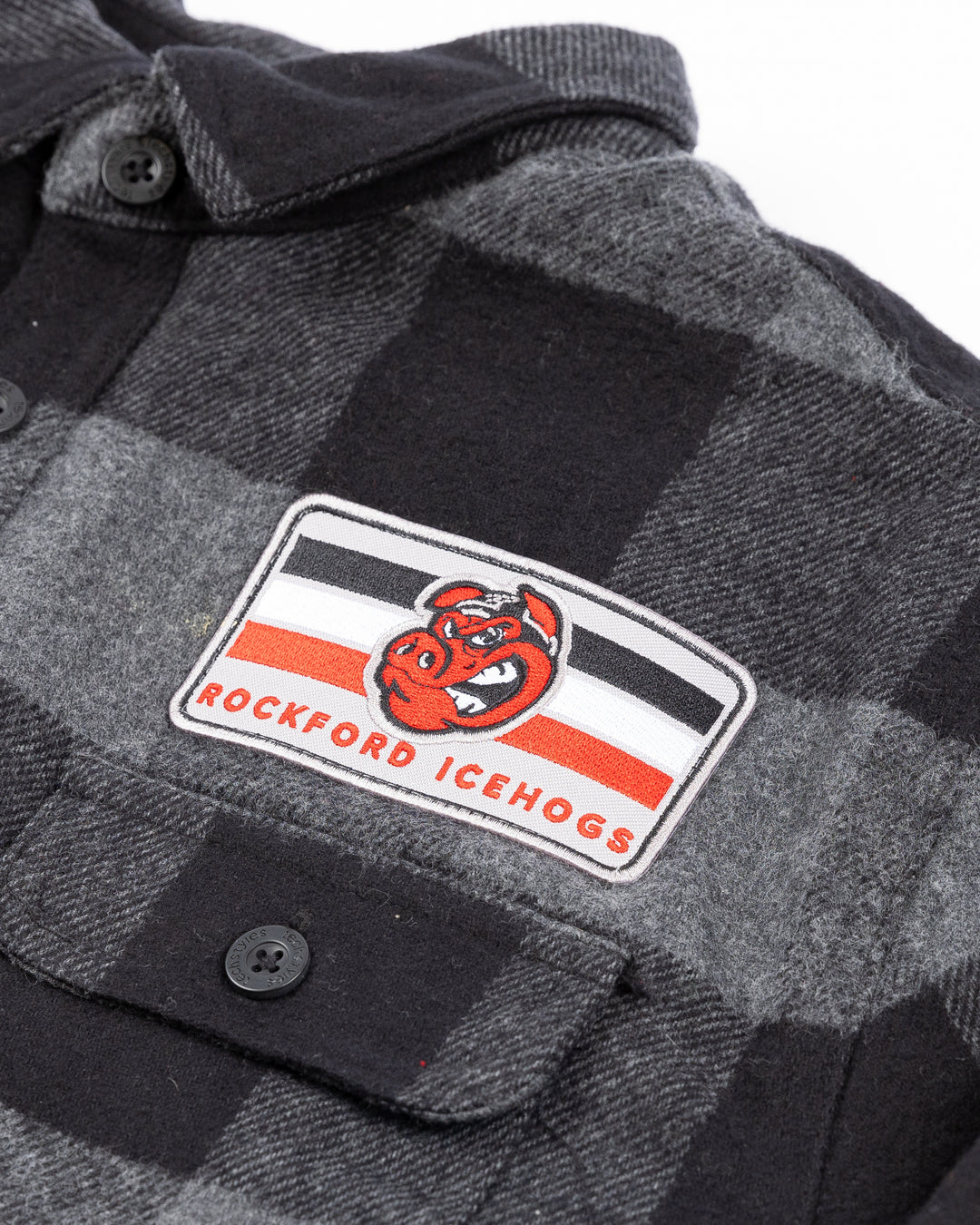 black and dark gray plaid button down flannel with Rockford IceHogs patch on left chest - front letail lay flat