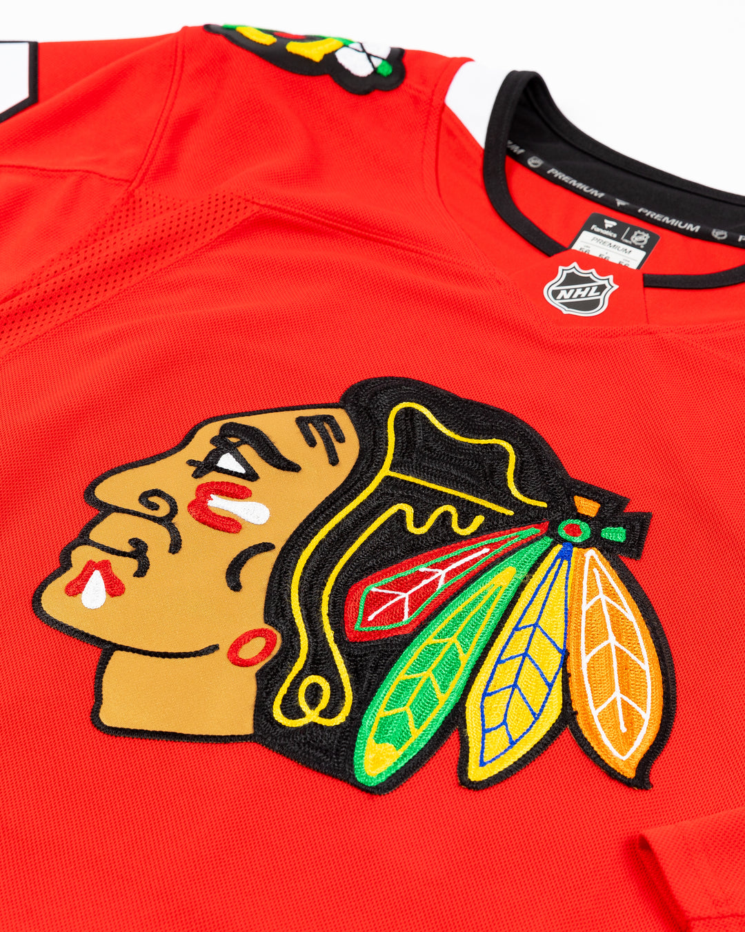 Fanatics red Premium home Chicago Blackhawks jersey with alumni Jeremy Roenick name and number - front detail lay flat