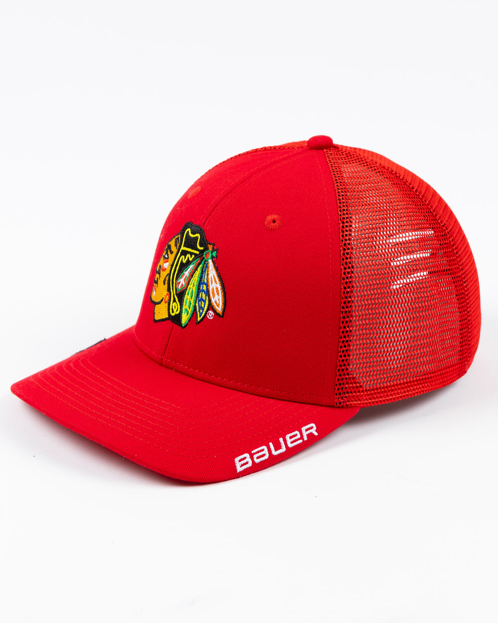 red Bauer adjustable snapback trucker hat with Chicago Blackhawks primary logo embroidered on front - left angle lay flat