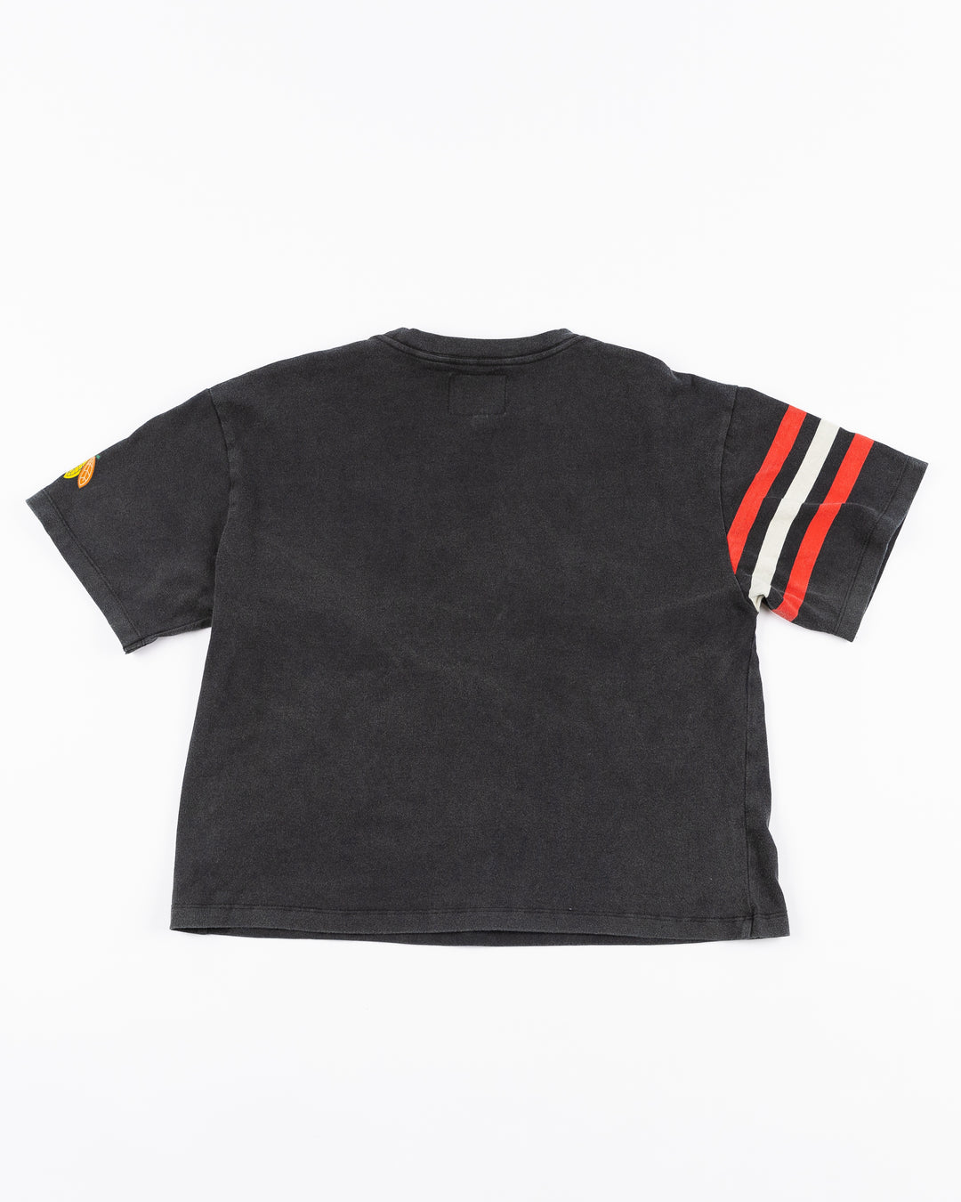 black cropped Alice & Wonder tee with Chicago wordmark graphic across front and Chicago Blackhawks primary logo on shoulder with jersey-inspired stripes on right sleeve - back lay flat