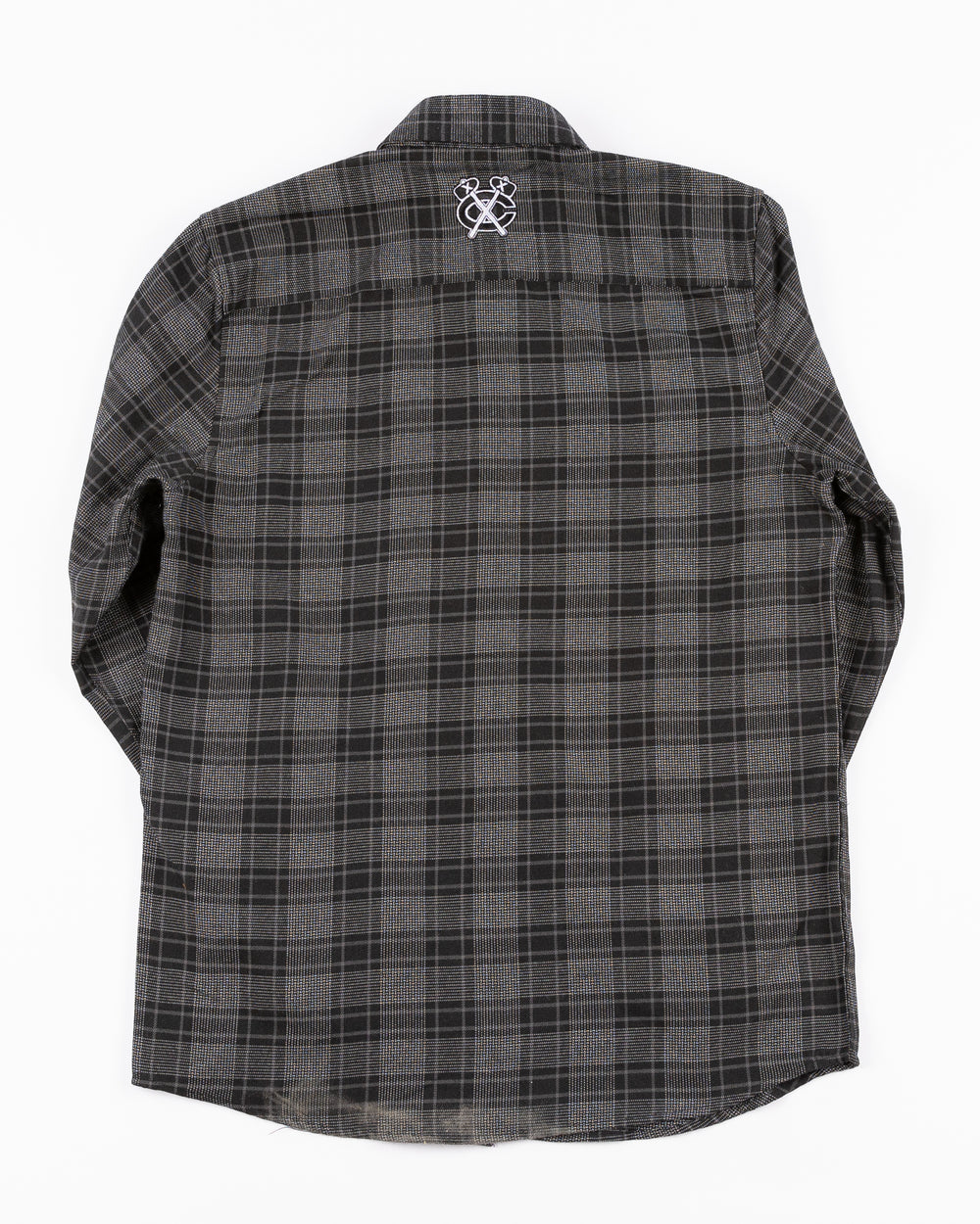 black VGHC flannel shirt with Chicago Blackhawks script embroidered in red on left chest pocket and black and white secondary logo on back yoke - back lay flat