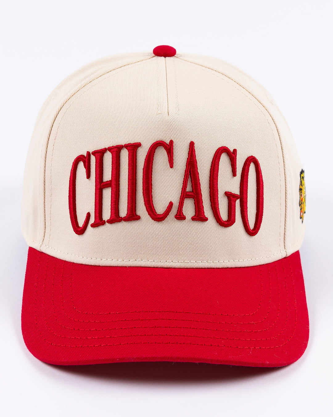 cream and red Alice & Wonder hat with Chicago wordmark on front and Chicago Blackhawks primary logo on left side - front lay flat