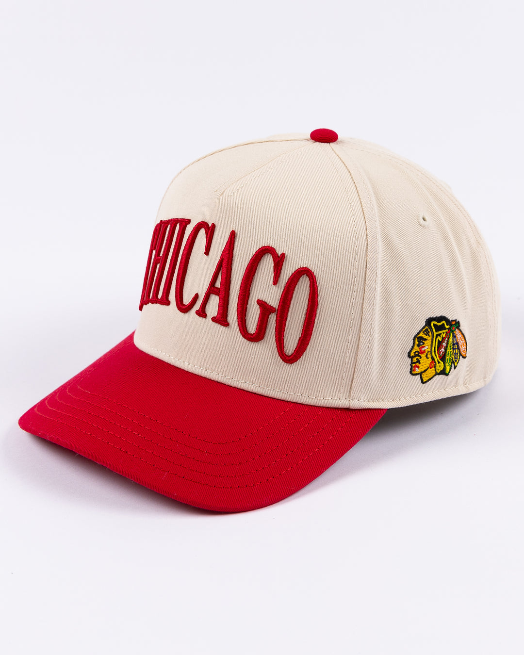 cream and red Alice & Wonder hat with Chicago wordmark on front and Chicago Blackhawks primary logo on left side - left angle lay flat