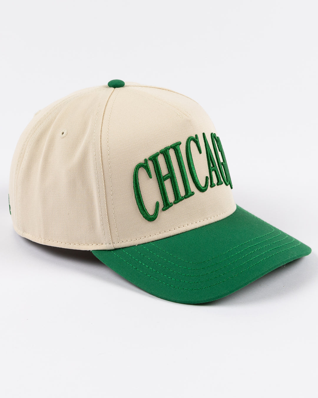 cream and green Alice & Wonder hat with Chicago wordmark on front and Chicago Blackhawks primary logo on left side - right side lay flat