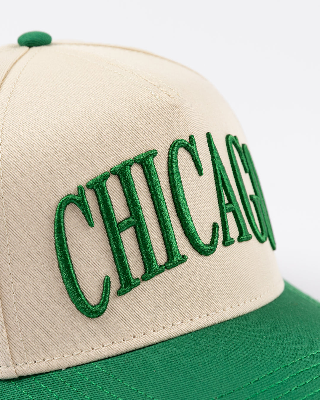 cream and green Alice & Wonder hat with Chicago wordmark on front and Chicago Blackhawks primary logo on left side - front detail lay flat