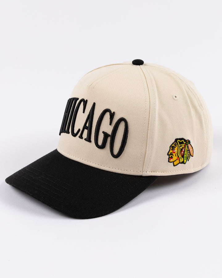 cream and black Alice & Wonder hat with Chicago wordmark on front and Chicago Blackhawks primary logo on left side - left angle lay flat