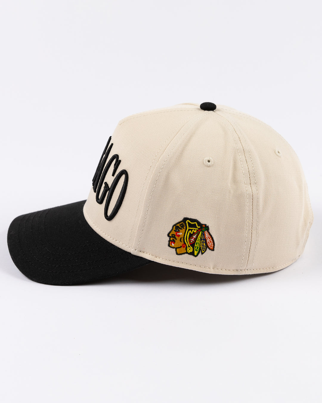 cream and black Alice & Wonder hat with Chicago wordmark on front and Chicago Blackhawks primary logo on left side - left side lay flat