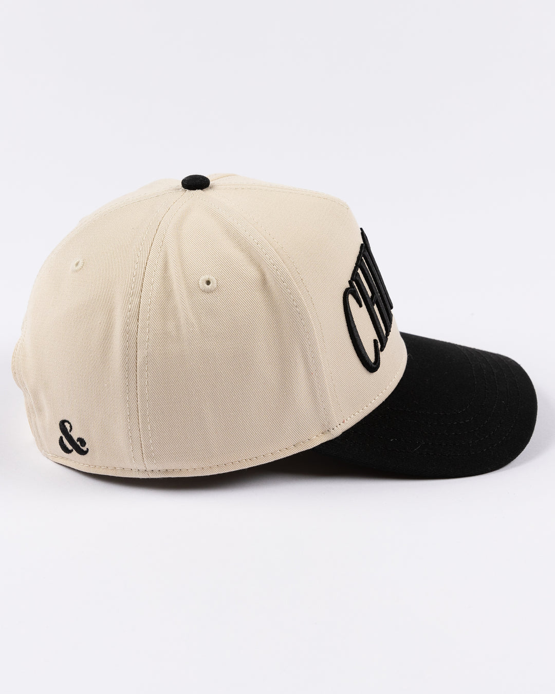 cream and black Alice & Wonder hat with Chicago wordmark on front and Chicago Blackhawks primary logo on left side - right side lay flat