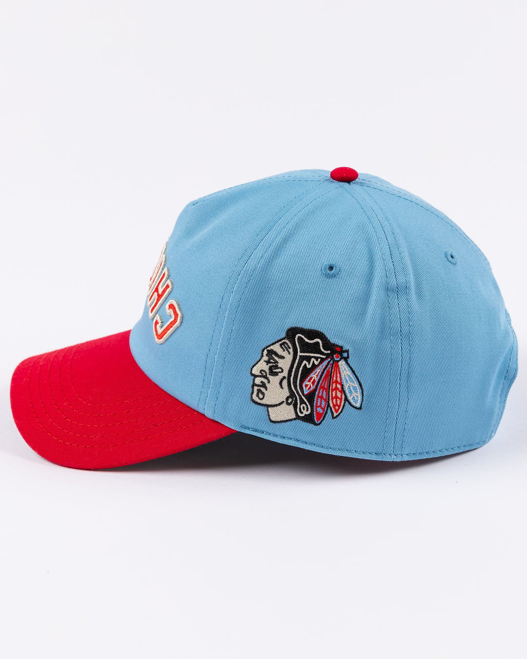 blue and red American Needle hat with upside down Chicago wordmark embroidered on front and Chicago Blackhawks primary logo on left side - left side lay flat