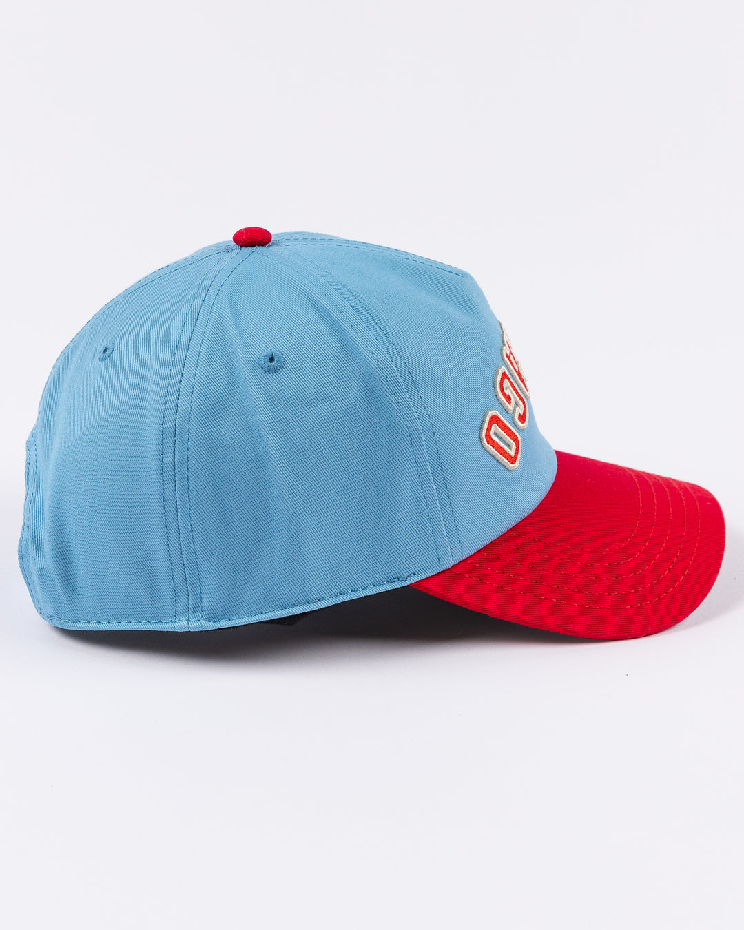 blue and red American Needle hat with upside down Chicago wordmark embroidered on front and Chicago Blackhawks primary logo on left side - right side lay flat