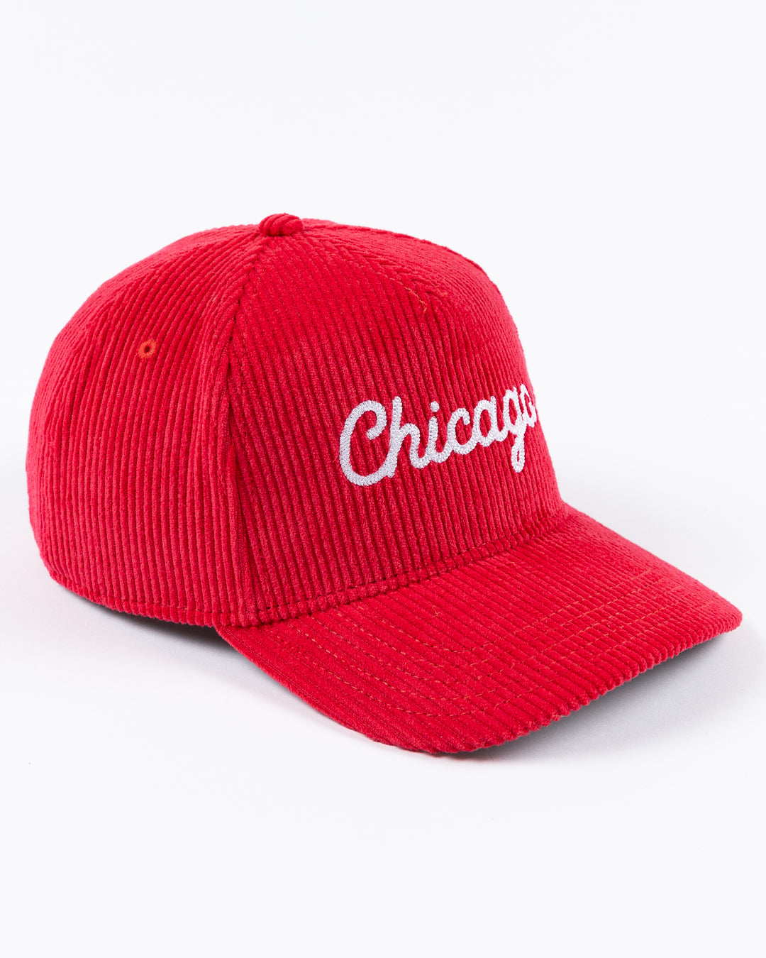 red corduroy Alice & Wonder adjustable hat with white chainstitched Chicago script graphic on front and Chicago Blackhawks primary logo on left side - right angle lay flat