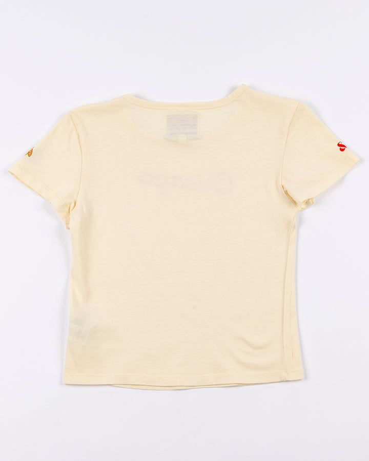 cream Alice & Wonder baby tee with red Chicago script graphic across front and Chicago Blackhawks logo on left sleeve - back lay flat