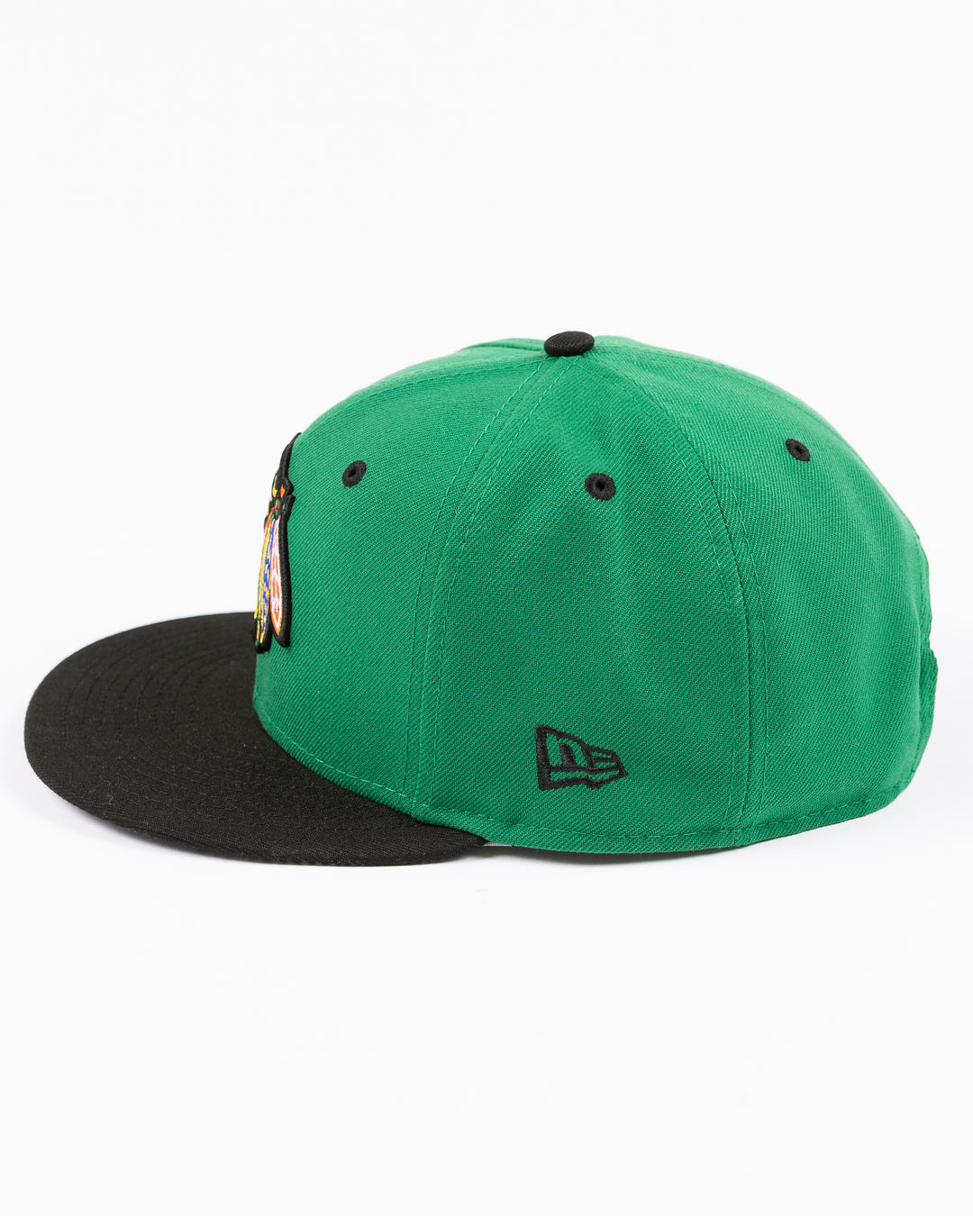 green and black New Era 9FIFTY snapback with Chicago Blackhawks primary logo embroidered on front and black and white star pattern on bottom brim - left side lay flat