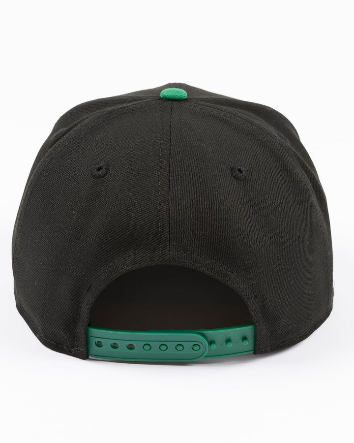 black and green two tone New Era 9FIFTY snapback with tonal Chicago Blackhawks secondary logo embroidered on front - back lay flat