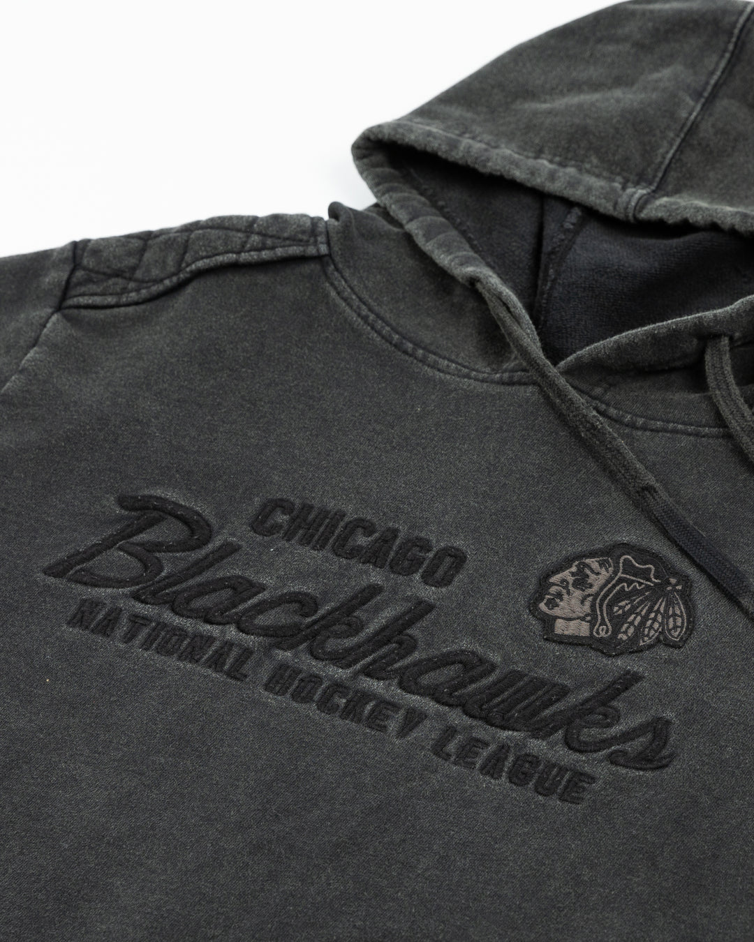 washed black American Needle hoodie with tonal vintage-inspired Chicago Blackhawks graphic on front - front detail lay flat