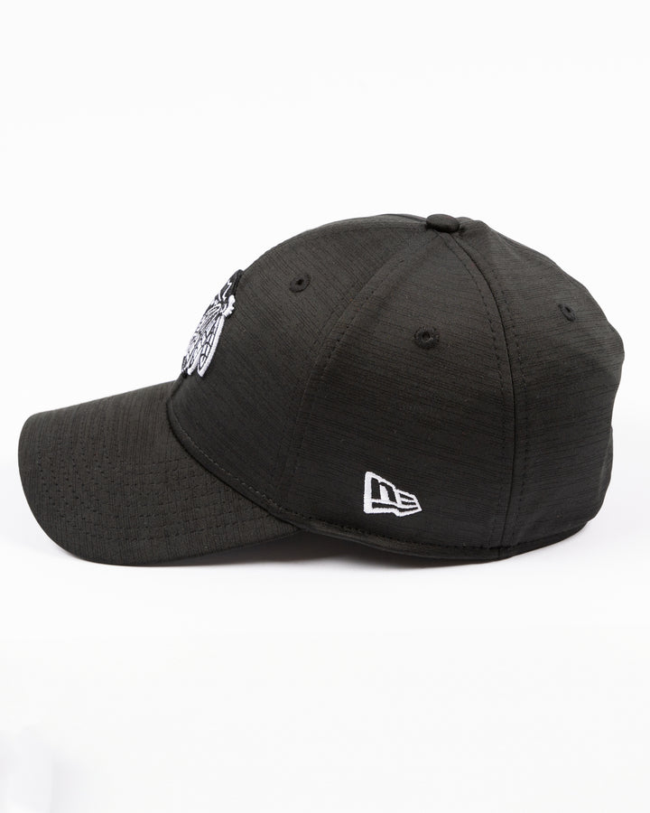 black New Era fitted hat with tonal embroidered Chicago Blackhawks primary logo on front - left side lay flat