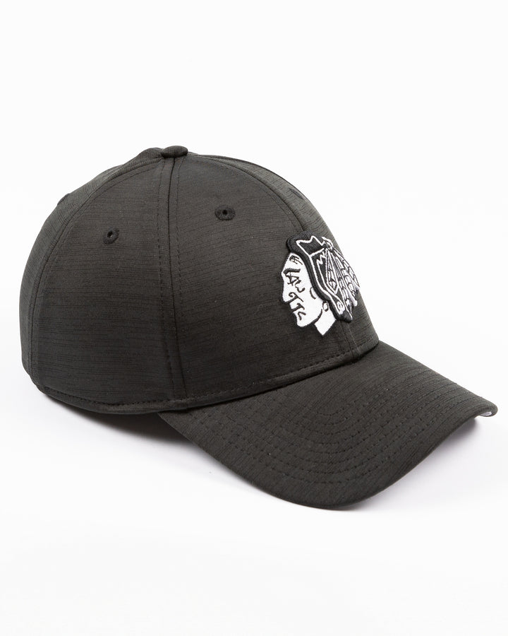 black New Era fitted hat with tonal embroidered Chicago Blackhawks primary logo on front - right angle lay flat