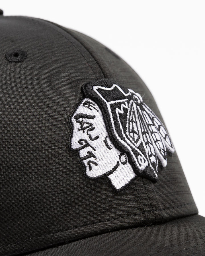 black New Era fitted hat with tonal embroidered Chicago Blackhawks primary logo on front - front detail lay flat