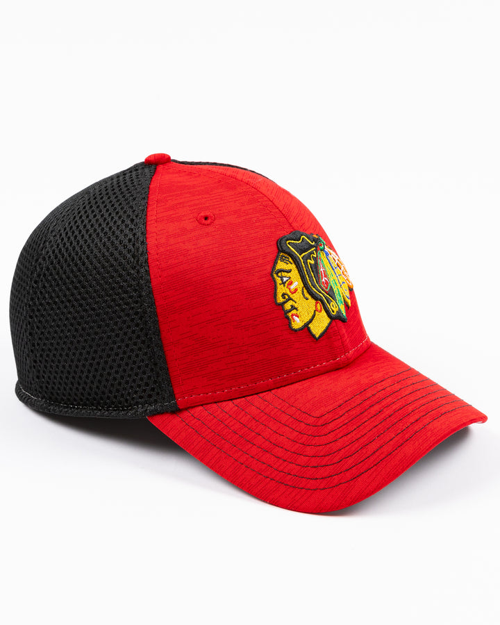 two tone red and black New Era cap with Chicago Blackhawks primary logo embroidered on front - right angle lay flat