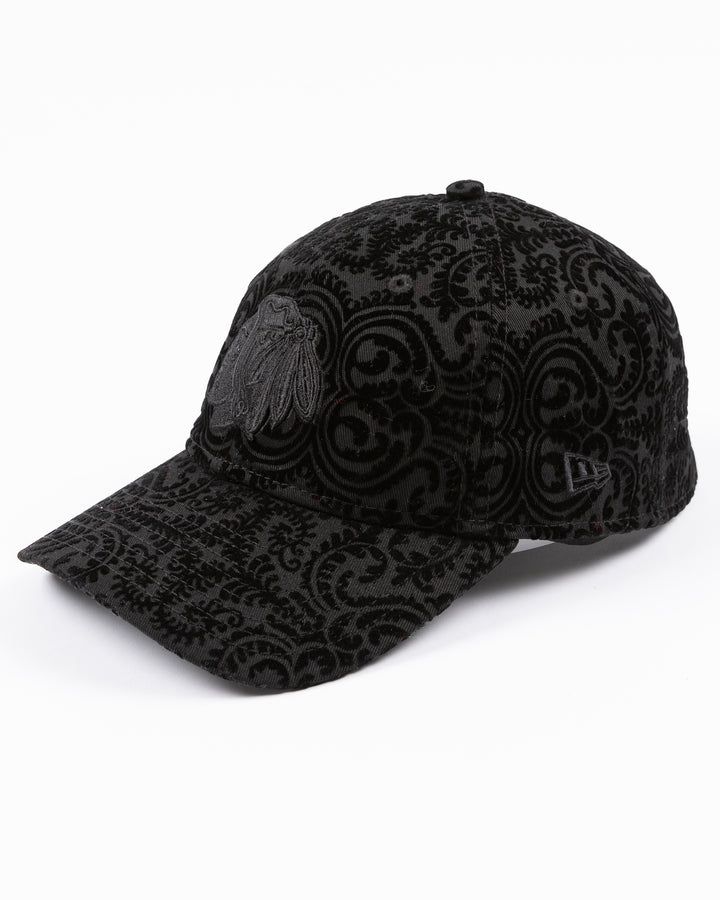 black New Era ladies hat with textured design and tonal Chicago Blackhawks primary logo embroidered on front - left angle lay flat