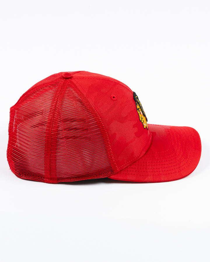 red camo New Era trucker cap with embroidered Chicago Blackhawks primary logo on front - right side lay flat