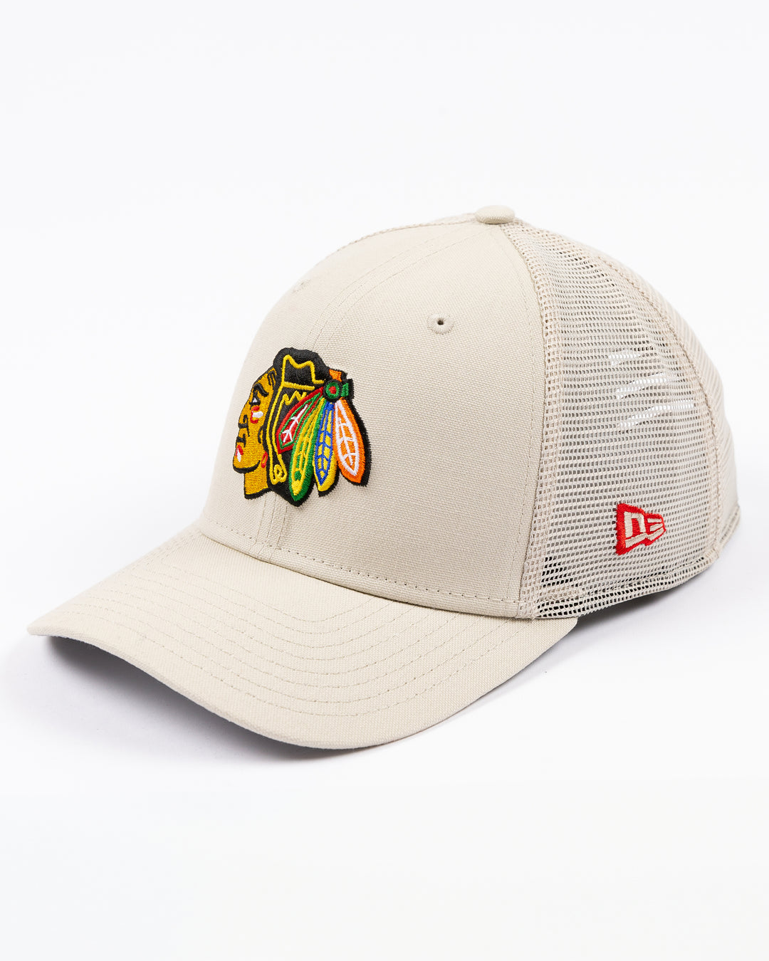 beige New Era adjustable snapback cap with Chicago Blackhawks primary logo embroidered on front - left angle lay flat