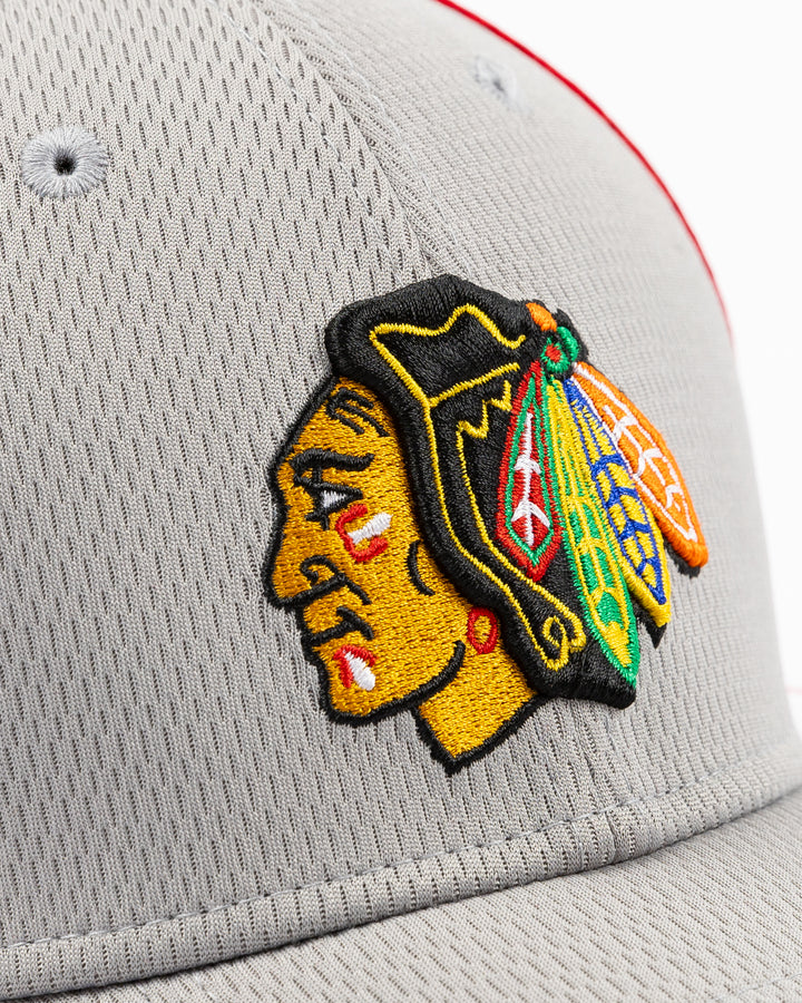 grey and red New Era fitted hat with Chicago Blackhawks primary logo embroidered on front - detail lay flat