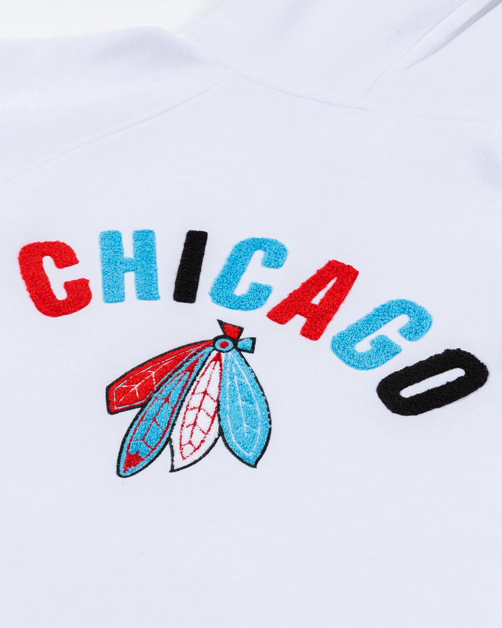 white oversized hoodie with Chicago Blackhawks secondary logo embroidered on front chest and Chicago wordmark and four feathers logo embroidered on back - back detail lay flat