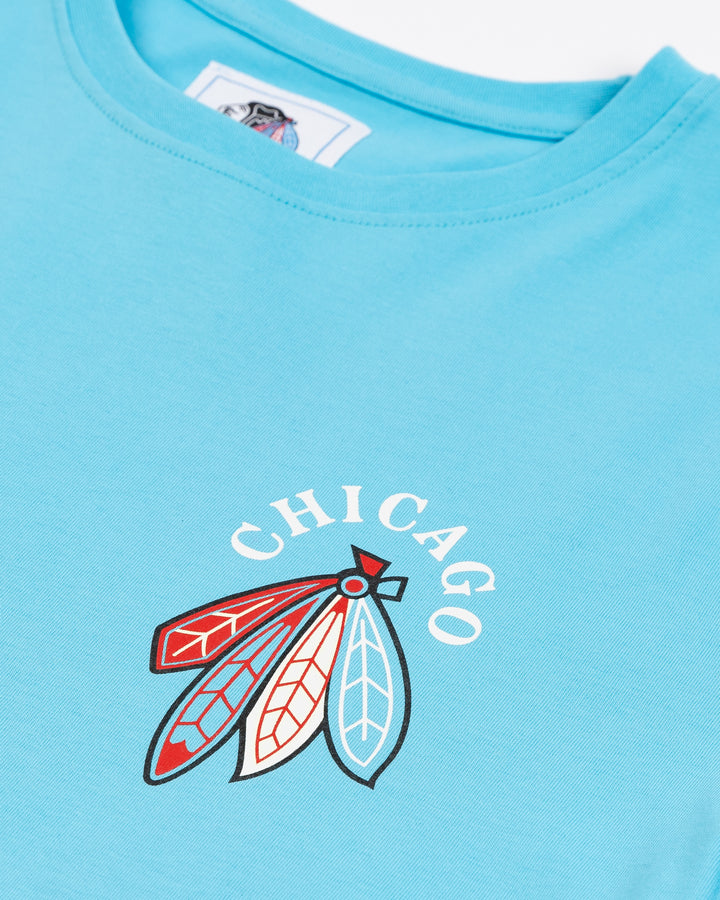 blue short sleeve tee with Chicago and Chicago Blackhawks four feathers logo on left chest and Chicago Blackhawks crest design on back - front detail lay flat