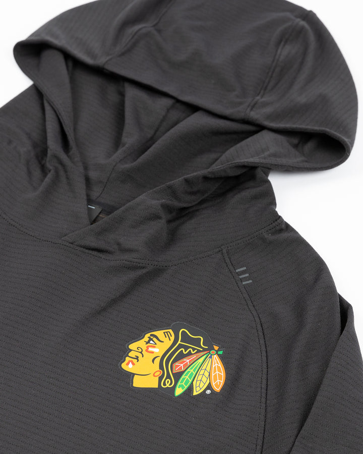 black lululemon men's training hoodie with Chicago Blackhawks primary logo printed on left chest - front detail lay flat