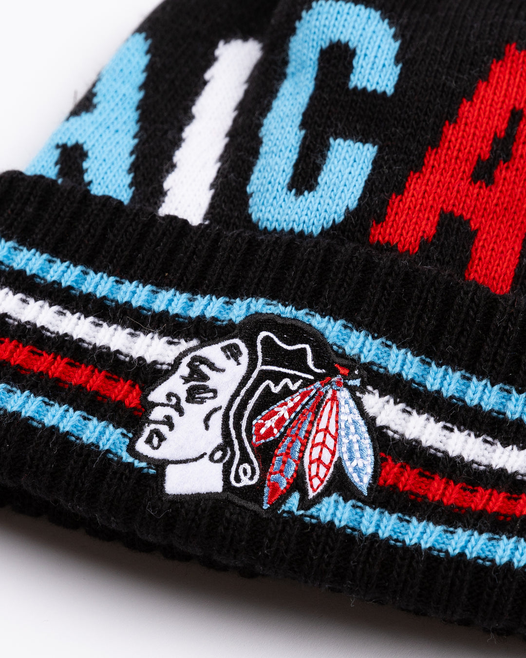 black knit hat with Chicago on front and Chicago Blackhawks primary logo embroidered on front striped cuff in Chicago flag-inspired colorway - front detail lay flat