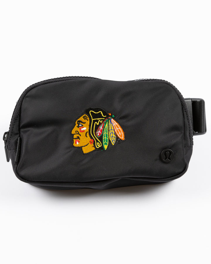 black lululemon belt bag with embroidered Chicago Blackhawks primary logo on front - front lay flat