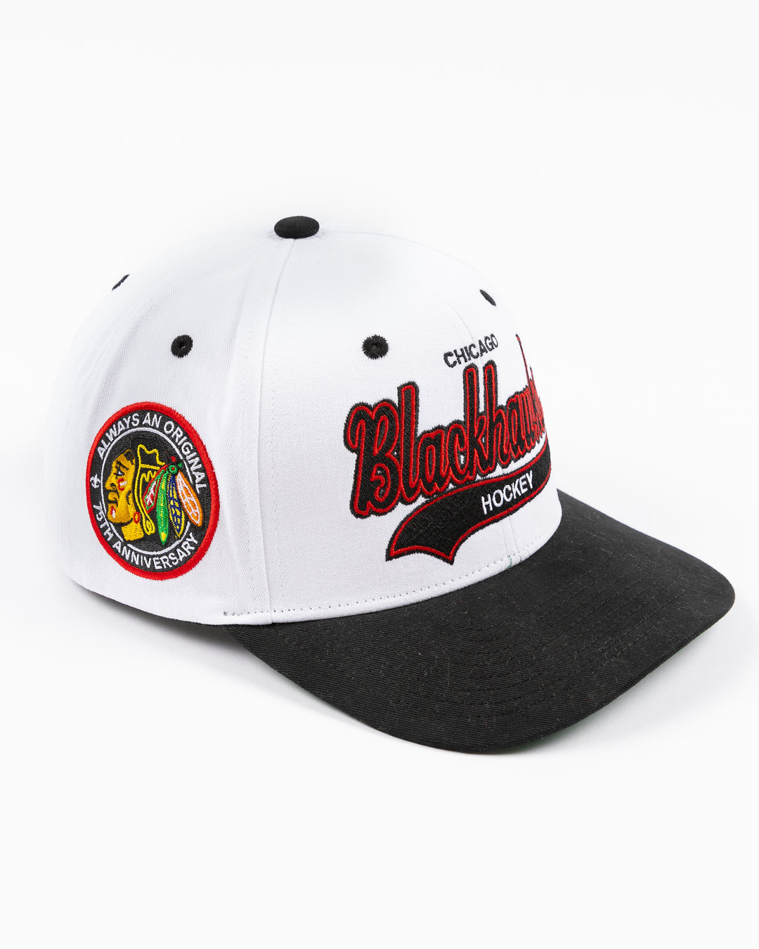 black and white Mitchell & Ness adjustable cap with embroidered Chicago Blackhawks hockey wordmark on front and primary logo on right side - right angle lay flat